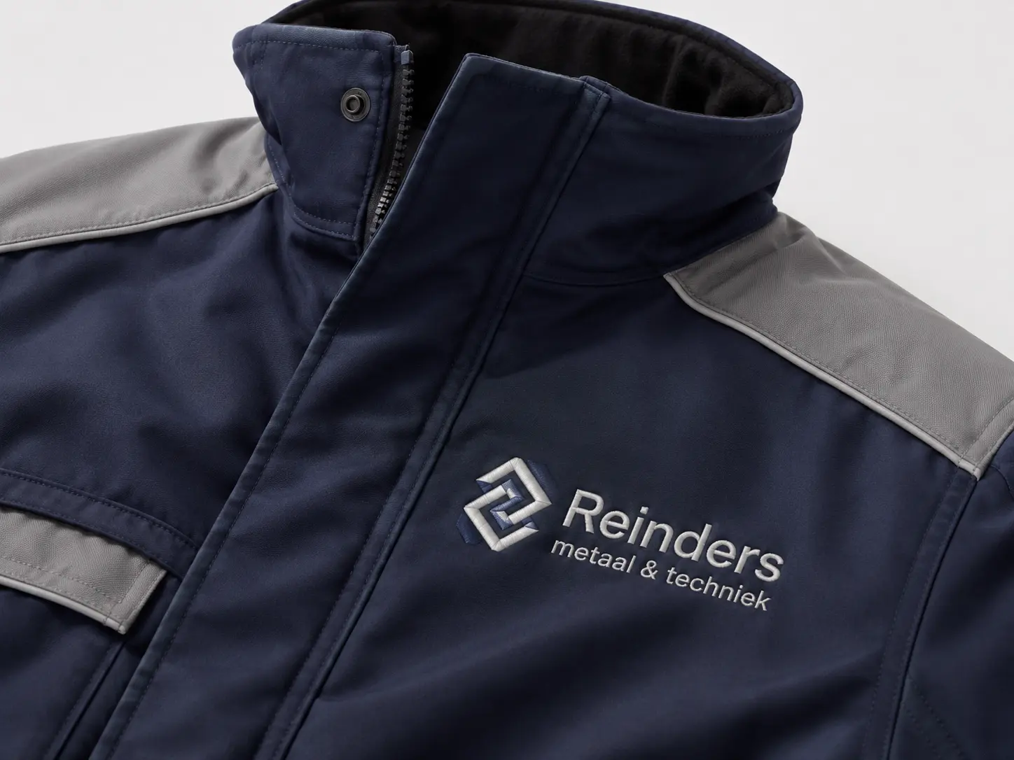 Geborduurde werkkleding met logo van Reinders metaal & techniek